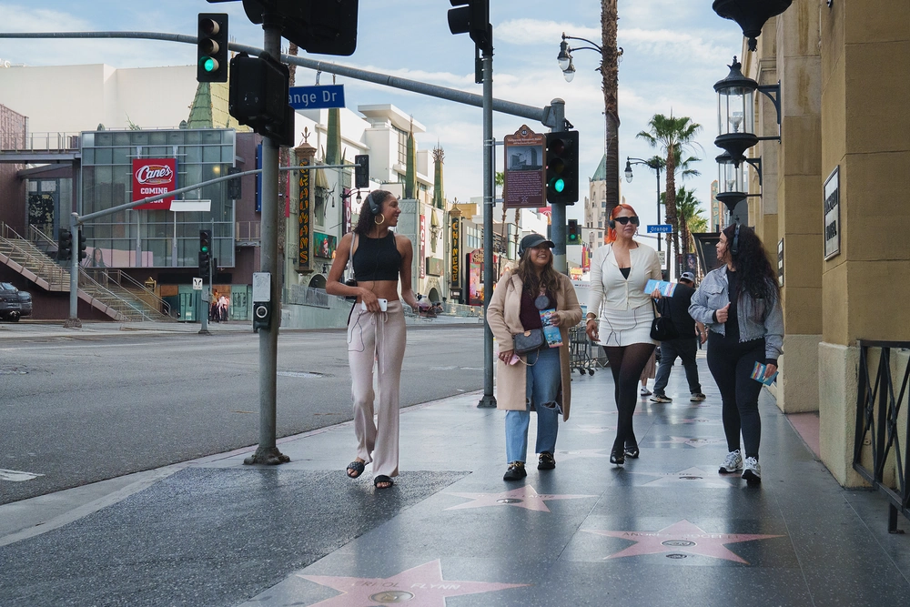 Private Hollywood tour guests walking along Hollywood Boulevard