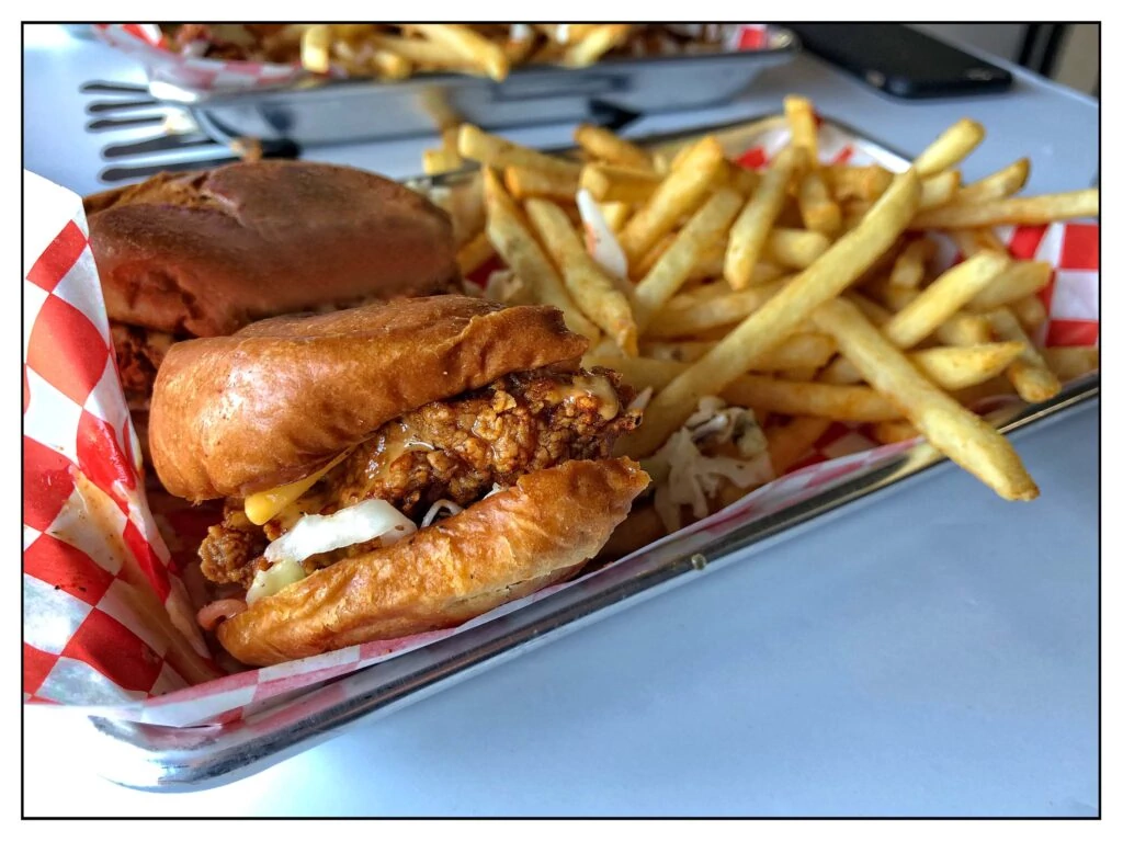 fried chicken sandwich with fries served at Hot Motha Clucker in Los Angeles