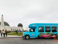 Hollywood Bus Tours vehicle parked outside Griffith Observatory Los Angeles