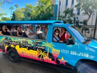 tourists riding Hollywood Bus Tours open-air sightseeing van in Los Angeles