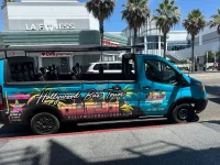 inside view of Hollywood bus tour with passengers and driver