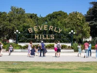 Beverly Hills sign landmark in Beverly Gardens Park with tourists