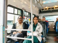tourists sitting inside Hollywood sightseeing bus during tour