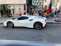 white Ferrari sports car parked on Rodeo Drive Beverly Hills