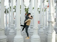 couple posing at Urban Light installation LACMA Los Angeles