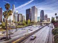 downtown Los Angeles skyline with freeway traffic