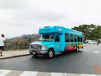 Hollywood Bus Tours sightseeing bus at Griffith Observatory viewpoint
