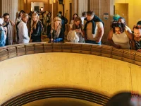 visitors watching Foucault pendulum inside Griffith Observatory