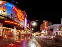 Hard Rock Cafe on Hollywood Boulevard at night with neon lights