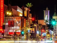 Hollywood Boulevard at night with Madame Tussauds and neon lights