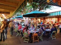 dining area at the Original Farmers Market Los Angeles with green seating
