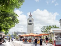 clock tower at Original Farmers Market in Los Angeles with shops and visitors
